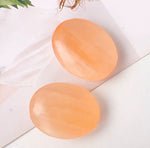 Orange selenite palmstone